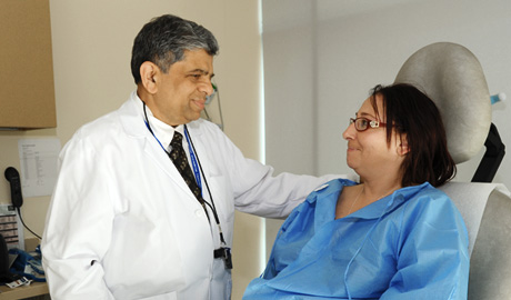 Dr. Ajay Shah comforting patient.