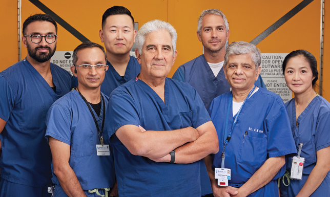 Dr. William Lois, Chairman, Surgery (center), with (L to R): Dr. Ajit Singh, Attending, Bariatric and Robotic Surgery; Dr. Vinayak Gowda, Attending, General, Breast, and Robotic Surgery; Dr. David Fan, Chief, Bariatric and Robotic Surgery; Dr. Matthew Furman, Chief, Surgical Oncology; Dr. Ajay Shah, Vice Chairman/Program Director, Surgery, and Chief, Breast Surgery; and Dr. Susan Chung, Chief, Plastic Surgery.